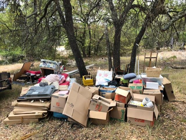 exterior junk trash in yard from resident Austin residential realtor connected us